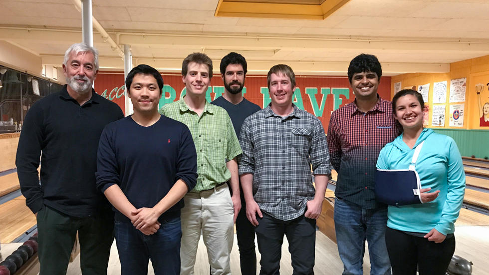 7 Farrell Lab members in group photo at bowling alley