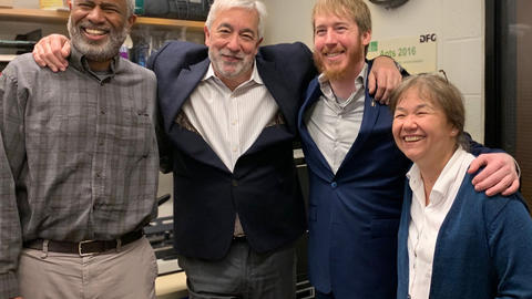 Celebratory photo of Patrick with his committee