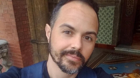 Paulino Siqueira Ribeiro, looking at the camera while wearing a blue shirt