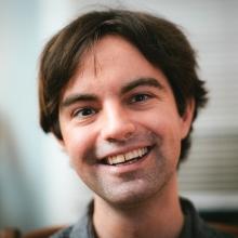Photograph of John Mewherter, smiling at the camera