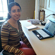 Marisol sitting at desk