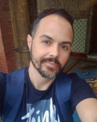 Paulino Siqueira Ribeiro, looking at the camera while wearing a blue shirt